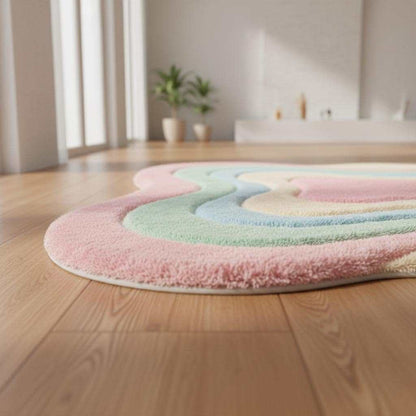 Wavy pastel shag rug with soft plush texture and abstract boho design in pink, green, blue, and cream colors