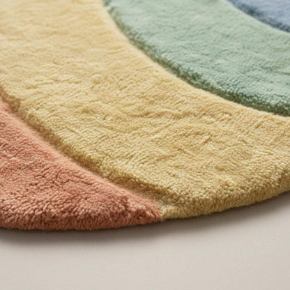 Pastel wavy rug with plush shag fibers and pastel rainbow colors in boho style carpet design