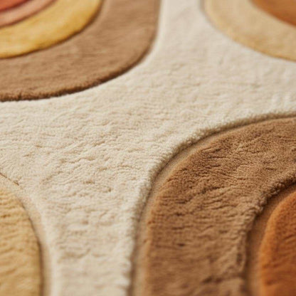 Mid century modern rug with retro geometric pattern in earth tones, plush shag texture, and hand tufted durable design.