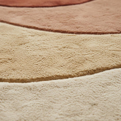 Abstract boho rug with plush soft pile and warm earth tones, featuring a modern mid century organic curved design for cozy home decor.