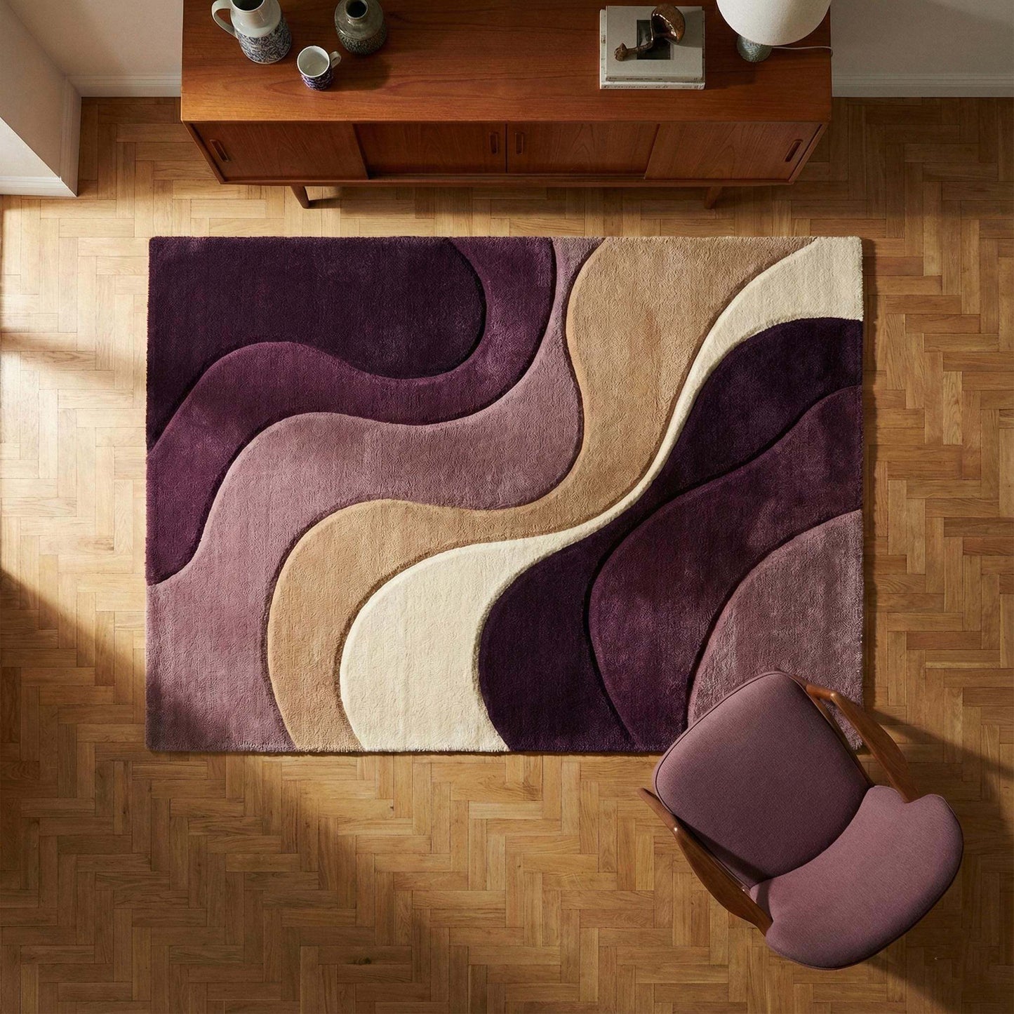 Modern abstract rug with plush mauve wavy pattern and neutral tones for contemporary living spaces