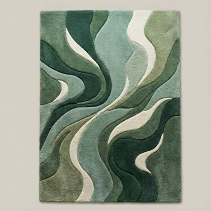 Top-down view of modern green abstract area rug displaying flowing wave design, layered green tones, and soft ivory accents.