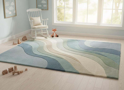 Soft abstract nursery rug with calming blue green wave design, ideal for baby room décor, cozy floor play, and soothing interior style