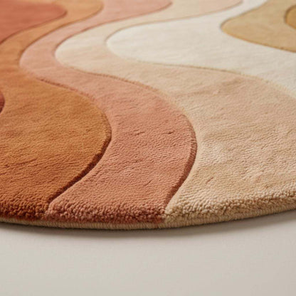 Warm color palette tufted wool rug featuring organic curves and soft gradient waves in a cozy modern interior.