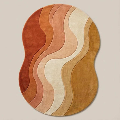 Modern wavy area rug with abstract ocean pattern in warm sunset colors, hand tufted 100% wool carpet with sculptural tufted design and freeform shape.