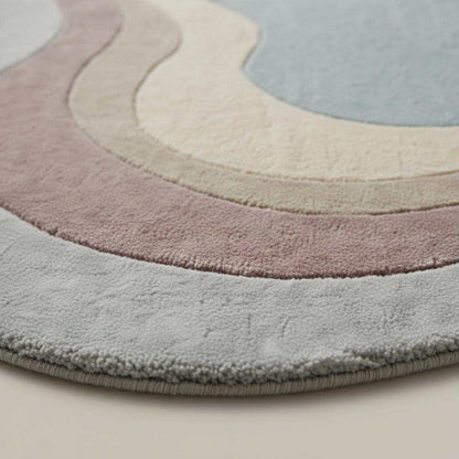 Hand-tufted handmade wool rug with organic shape and soft plush texture for living room and bedroom decor