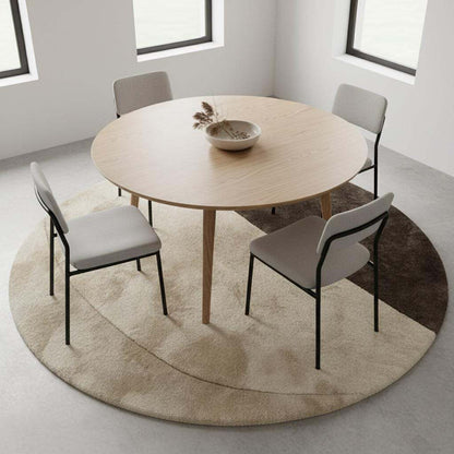 Plush contemporary round area rug with cream and taupe curved design, perfect for Japandi, modern, or Scandinavian interiors.