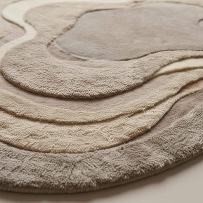Contemporary taupe and cream wool carpet featuring soft curves and a sculpted design.