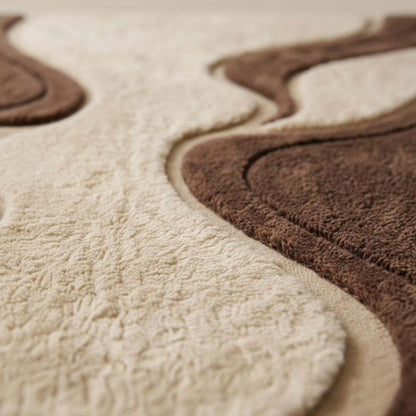 Mid century shag rug with retro geometric pattern and soft textured brown cream pile