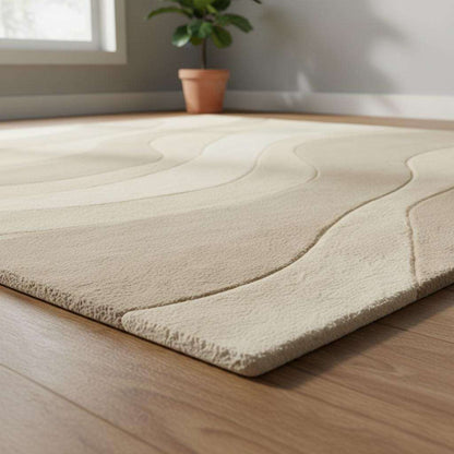 Minimalist beige and cream rug with elegant wavy lines adding warmth and texture to a serene living room space.