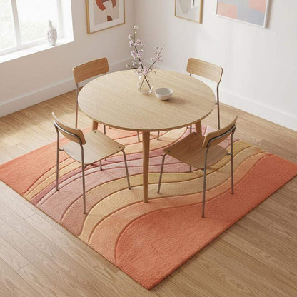 Luxury hand-tufted wool rug with flowing waves and soft gradient palette adding warmth and texture to interior spaces.