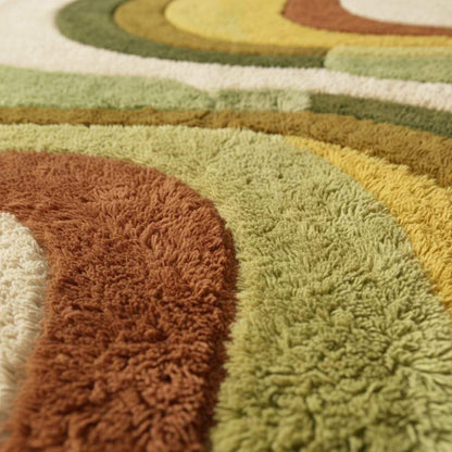 Retro boho area rug with abstract shag pattern and earth tone colors
