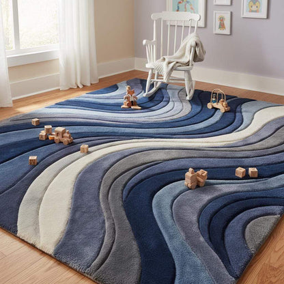 Plush textured living room rug with modern wave design in navy, slate blue, and gray