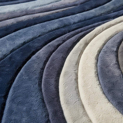 Mid Century Modern Rug with blue sculpted wave pattern and plush texture