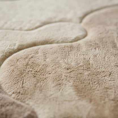 Organic area rug with plush high pile and neutral sculpted pattern for Scandinavian Japandi living room decor