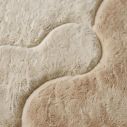 Organic area rug with plush beige and ivory sculpted pattern, perfect for Scandinavian Japandi living rooms
