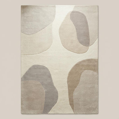 Top-down view of abstract area rug displaying full organic shape pattern, neutral beige and cream color palette, and balanced modern design suitable for contemporary interiors.