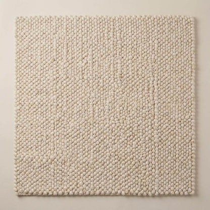 Handwoven chunky wool pebble rug in cream with textured minimalist design for Scandinavian home decor