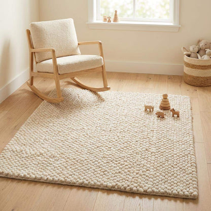 Handwoven chunky wool pebble rug in cream with textured pebble design for Scandinavian minimalist decor