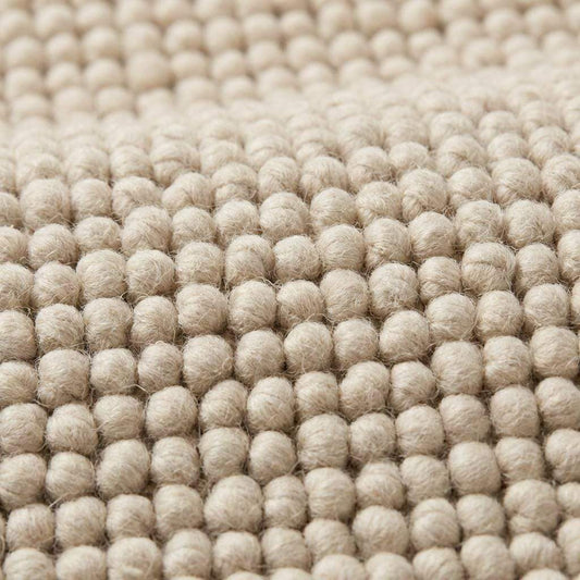 Handmade chunky wool rug thick neutral cozy textured minimalist Scandinavian style floor mat
