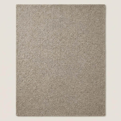 Chunky wool rug in neutral beige with thick loop weave for cozy minimalist Scandinavian decor