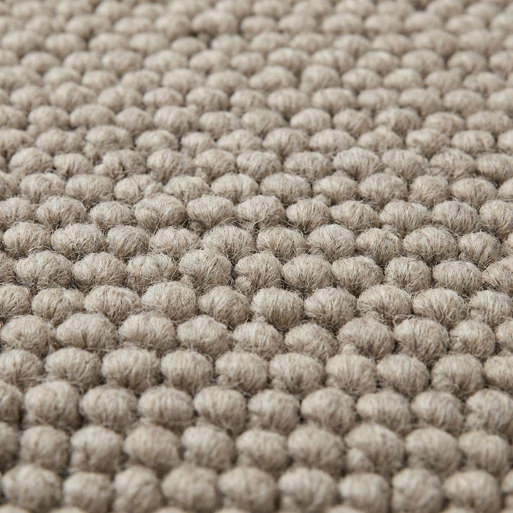 Chunky wool rug with thick loop weave in neutral beige, minimalist Scandinavian style living room decor