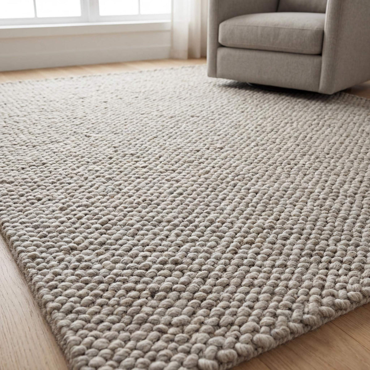 Chunky wool rug in neutral beige with thick loop weave for minimalist Scandinavian decor