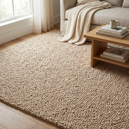 Chunky wool rug with thick loop pile in neutral beige for cozy minimalist living room decor