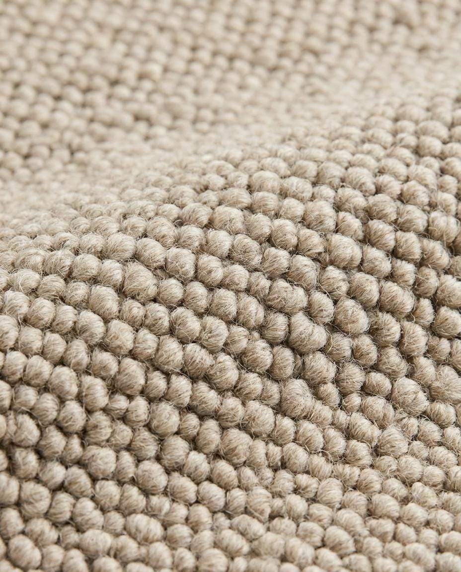 Chunky wool loop rug in neutral beige with textured, handmade cozy minimalist design