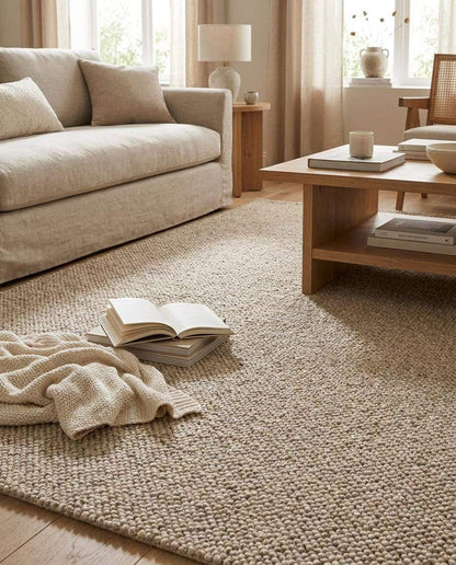 Chunky wool loop rug in neutral beige with textured handmade design for cozy minimalist interiors