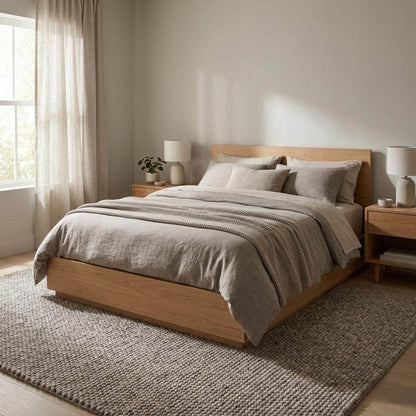 Chunky wool area rug in neutral beige with thick textured weave for cozy minimalist living room decor
