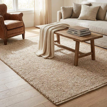 Chunky wool pebble rug in neutral beige, handwoven textured area rug for minimalist modern living room decor