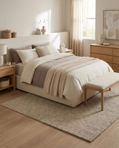 Neutral beige chunky wool loop rug with textured weave in minimalist living room setting