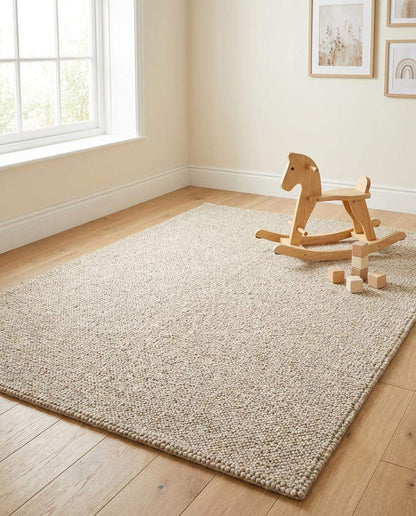 Neutral beige chunky wool loop rug with textured, handmade cozy minimalist design for modern interiors