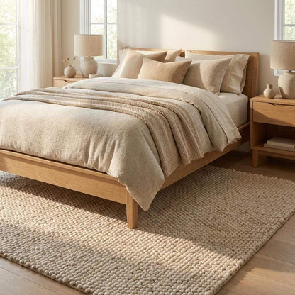 Handmade felt ball wool rug in neutral ivory with chunky texture for Scandinavian home decor