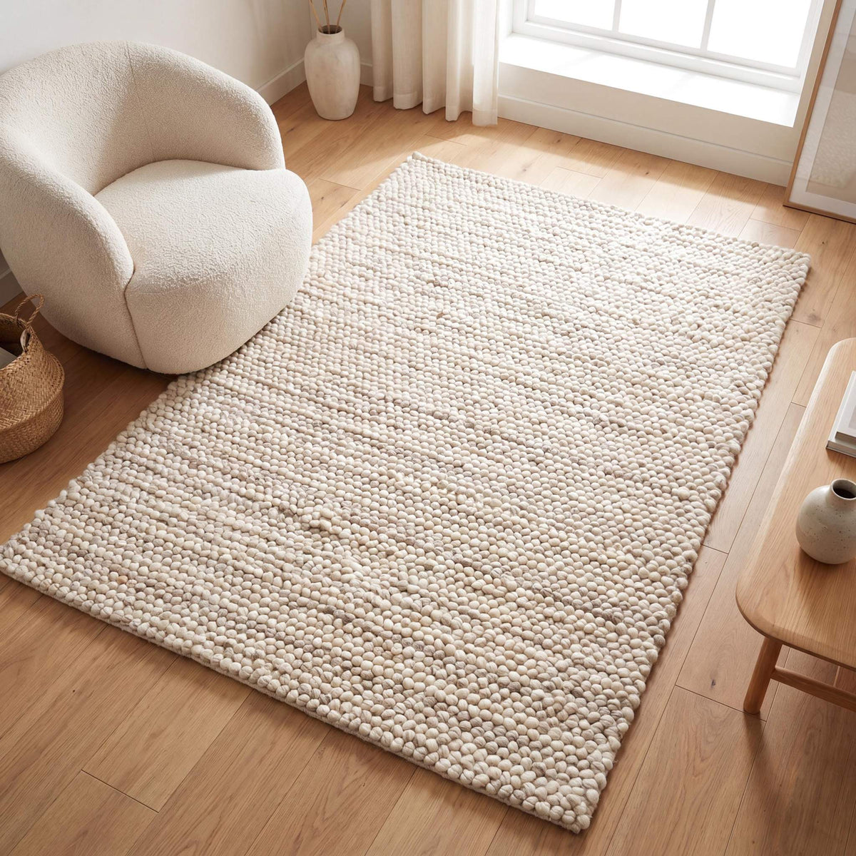 Handmade felt ball wool rug in neutral ivory, chunky texture, Scandinavian style area rug