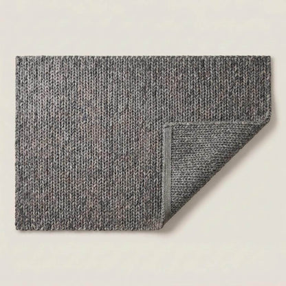 Handwoven chunky knit wool rug in gray with oversized braid design for modern Scandinavian living room decor