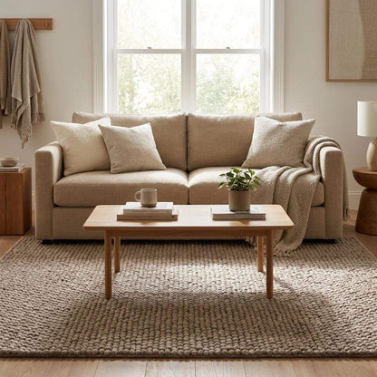 Handmade chunky wool rug with neutral pebble weave for Scandinavian Japandi living room decor