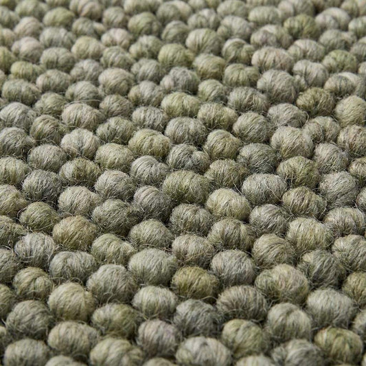 Handmade chunky wool rug with pebble texture in neutral tones for Scandinavian modern farmhouse decor