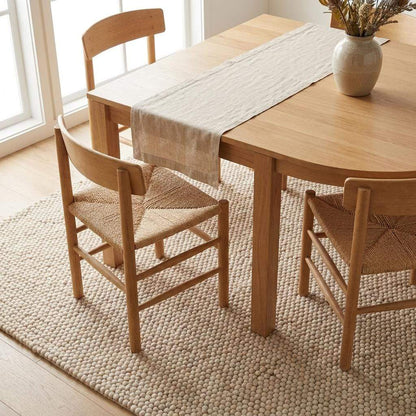 Handmade felt ball wool rug in neutral ivory with chunky texture for Scandinavian home decor