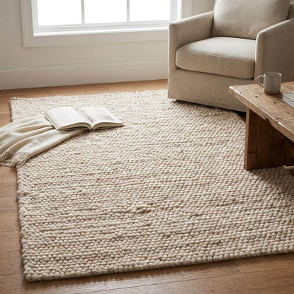 Handmade felt ball wool rug in neutral ivory with chunky texture for Scandinavian home decor