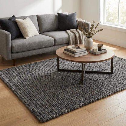 Handwoven chunky knit wool rug in gray with oversized braid design for modern Scandinavian home decor