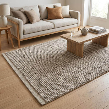 Hand woven chunky loop wool rug in ivory beige with textured Scandinavian design