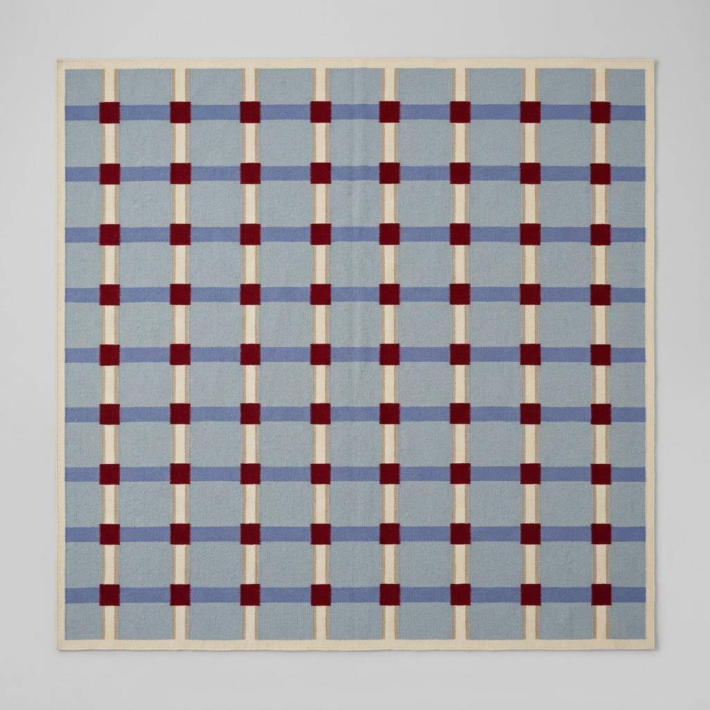 Pale blue flatweave wool rug with red grid check pattern, handwoven dhurrie for modern living room