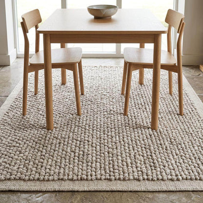 Chunky loop wool rug hand woven ivory beige textured Scandinavian living room floor covering