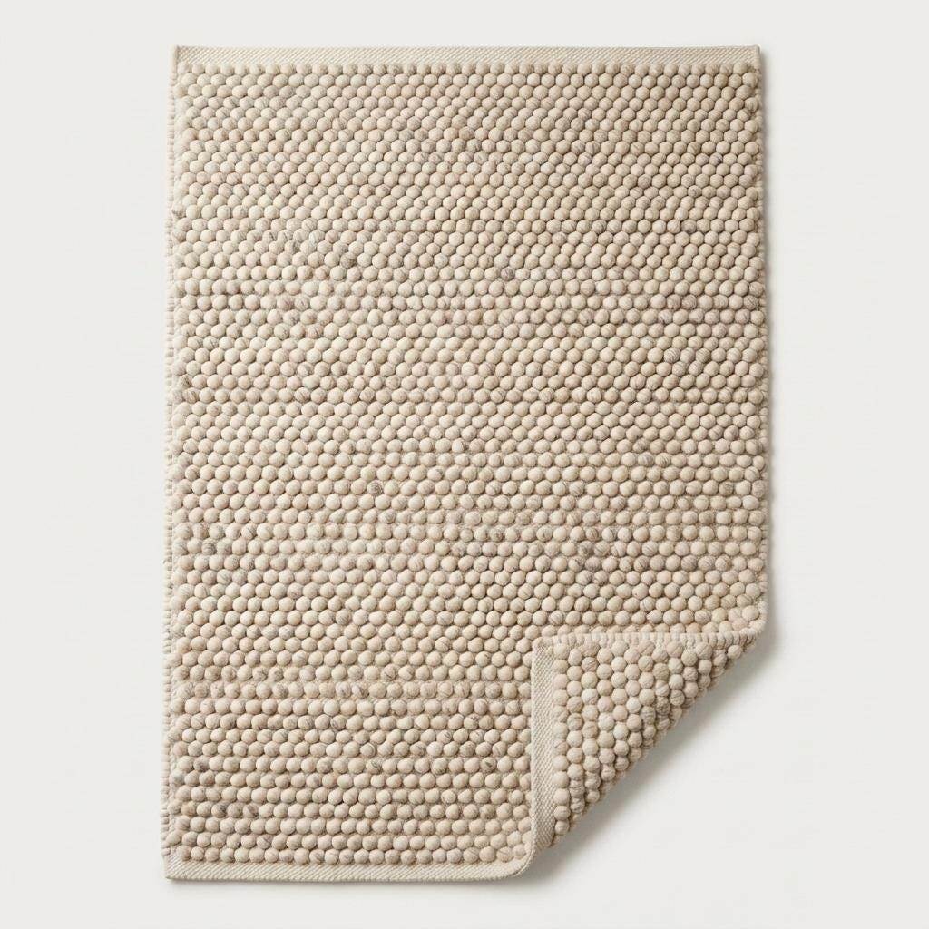 Handwoven pebble weave wool area rug in ivory beige with textured chunky loops for living room decor