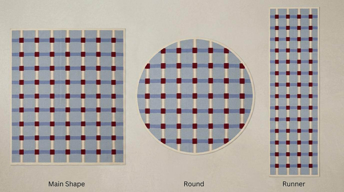 Handwoven pale blue flatweave wool rug with red grid check pattern for modern living room
