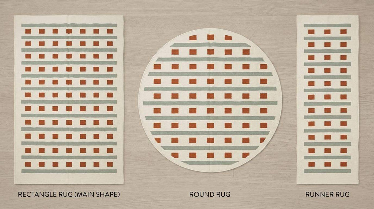 Ivory sage green flatweave dhurrie rug with terracotta squares and stripes in living room setting