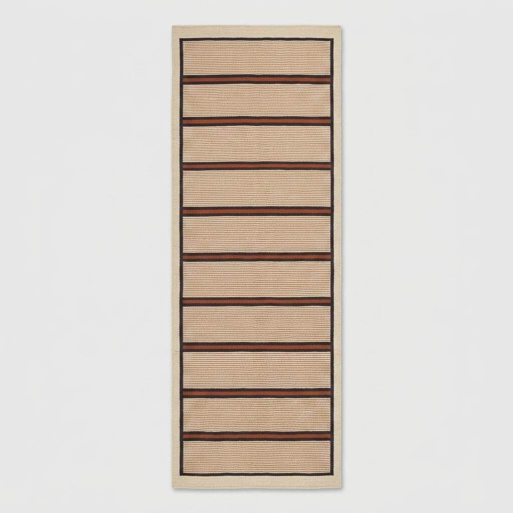 Handwoven wool flatweave runner rug with ivory, navy, and rust stripes for kitchen or hallway