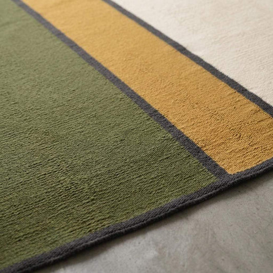 Olive green wool flatweave rug with mustard and ivory color blocks and charcoal border
